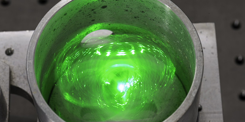 Glowing green item inside a container.
