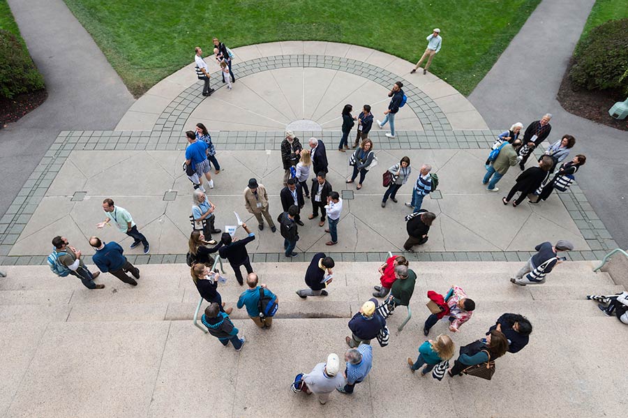 An overhead view of a group of people gathering.