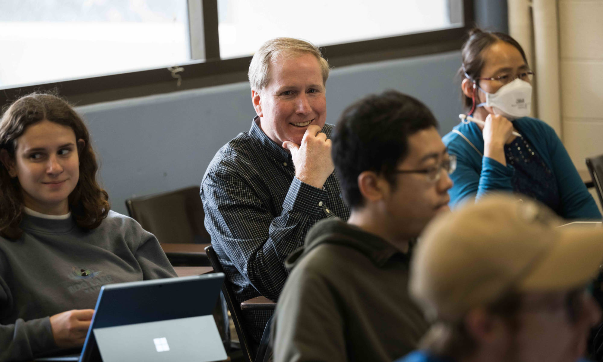 James McGrath sits among his biomedical engineering students in a Hylan Hall classroom.