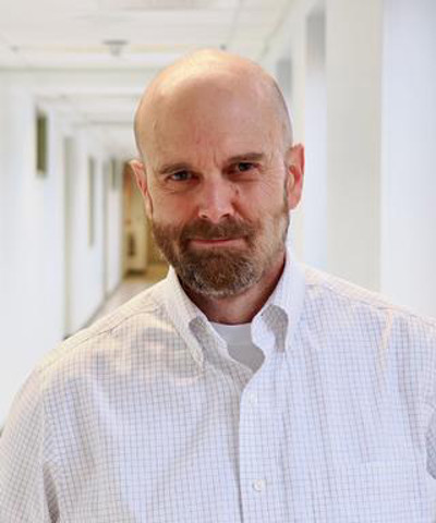 Headshot of Benjamin L. Miller.