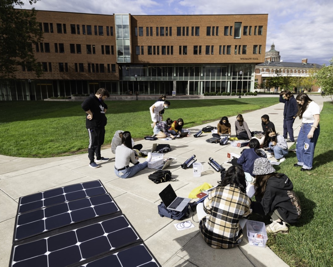 Students in class outside on the quad.