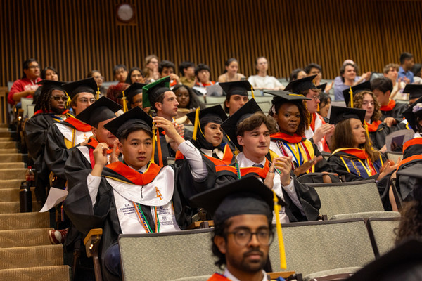 2026 graduating students sitting in auditorium.