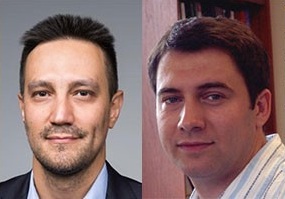 two men looking at camera