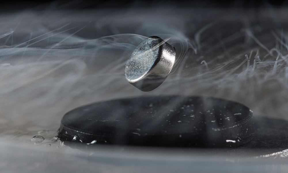 Photo from Dias's lab, in which a magnet floats above a superconductor cooled with liquid nitrogen.