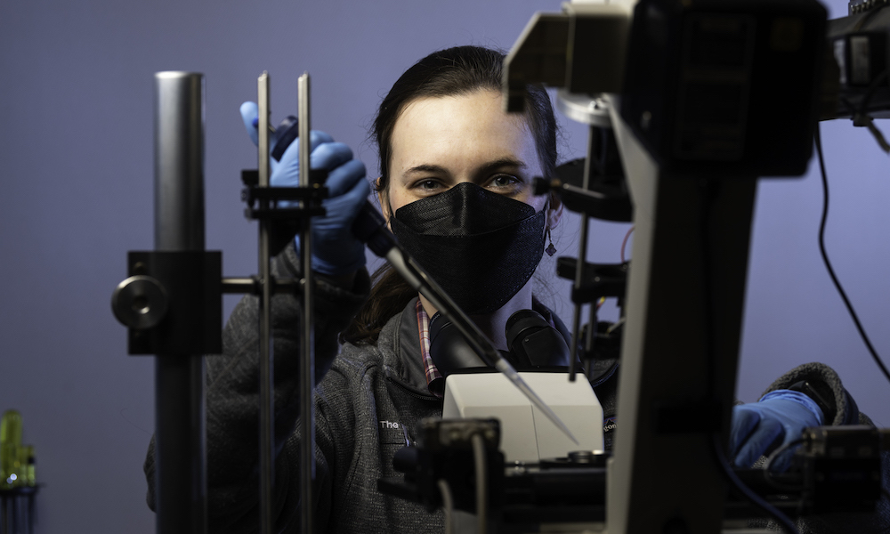 PhD student Katie Dunn prepares samples for imaging cells using a quantitative phase microscope at the Institute of Optics.