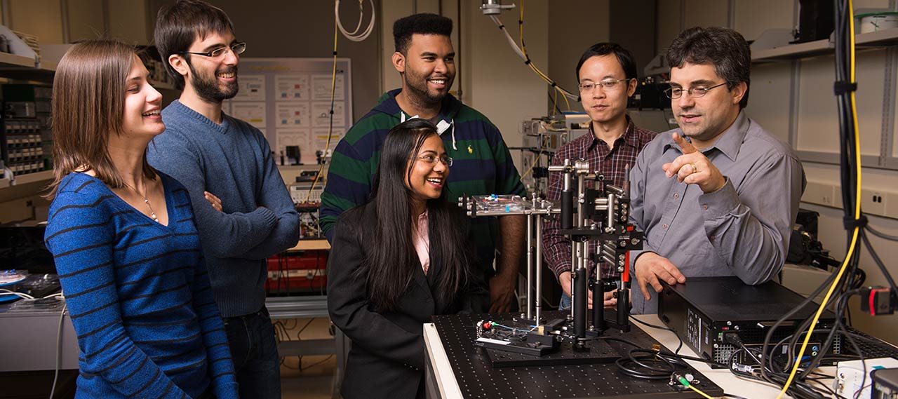 Students with a professor in a lab