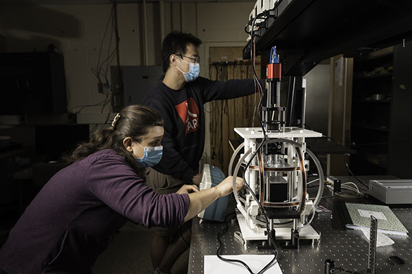 Two students working in a lab.