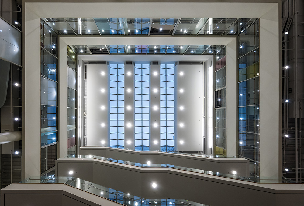 A view of the atrium of Goergen Hall as seen by looking up.
