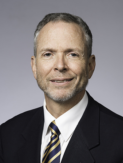 Headshot of Professor Zavislan.