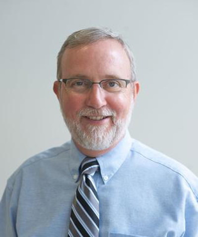 Headshot of Richard E. Waugh.