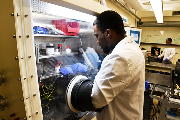 A student working on research in a lab.