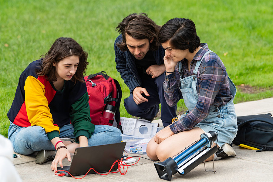 The professor and two students testing out their project.