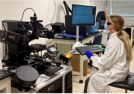 A student working in a lab on a computer.