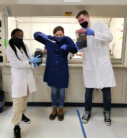 Three students working in the lab.