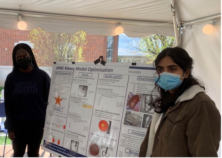 Students presenting their poster at the poster session.