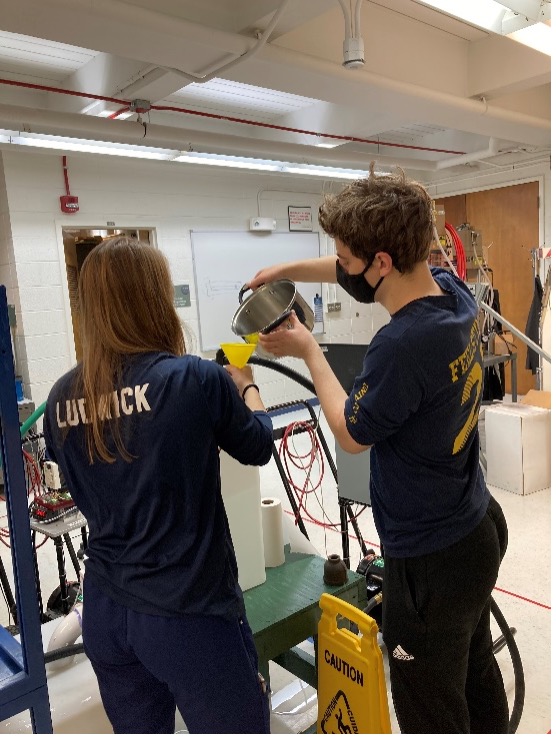 Two students working in the lab.