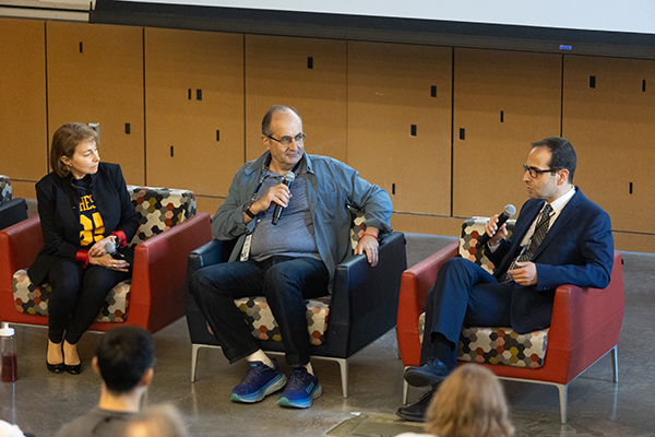 Panelists speaking to the attendees.