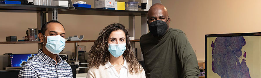 Marvin Doyley and two students in his lab.