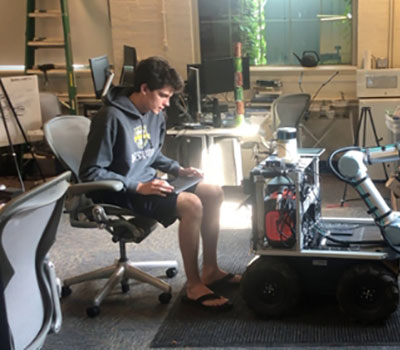 A student working on a project in a lab.