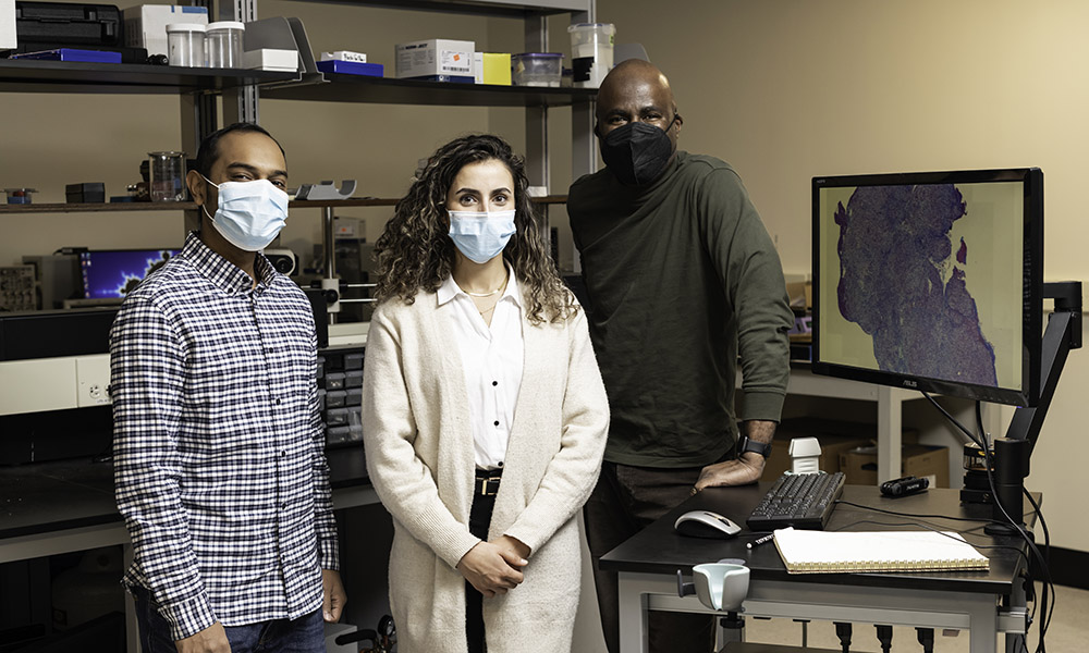 Marvin Doyley, right, professor and chair of electrical and computer engineering, and PhD students Irteza (Enan) Kabir, left, and Reem Mislati.