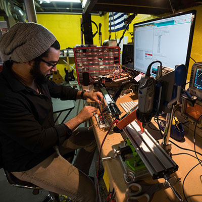 An undergraduate student working in a lab.