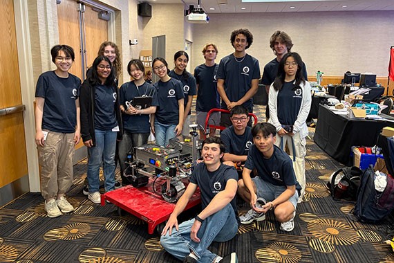 Group photo of lunabotics team with lunabot