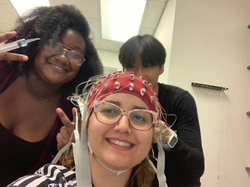 Three students taking a selfie in a lab