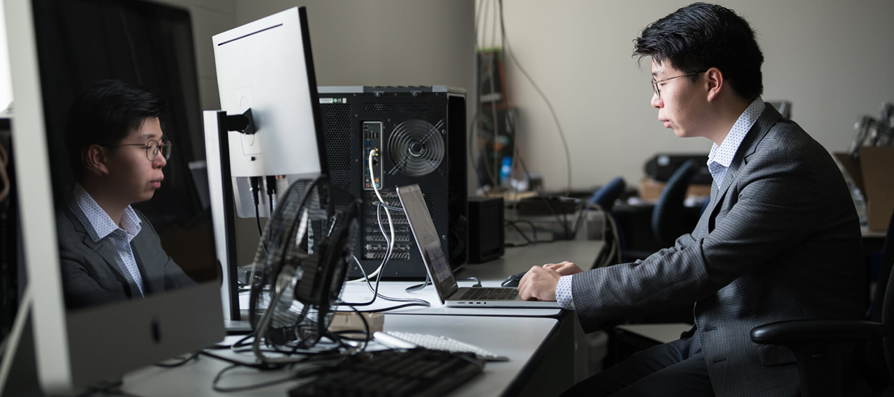 Students working around a computer.