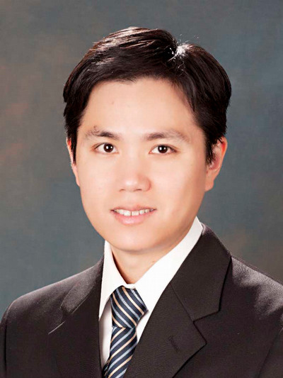 man wearing suit looking at camera