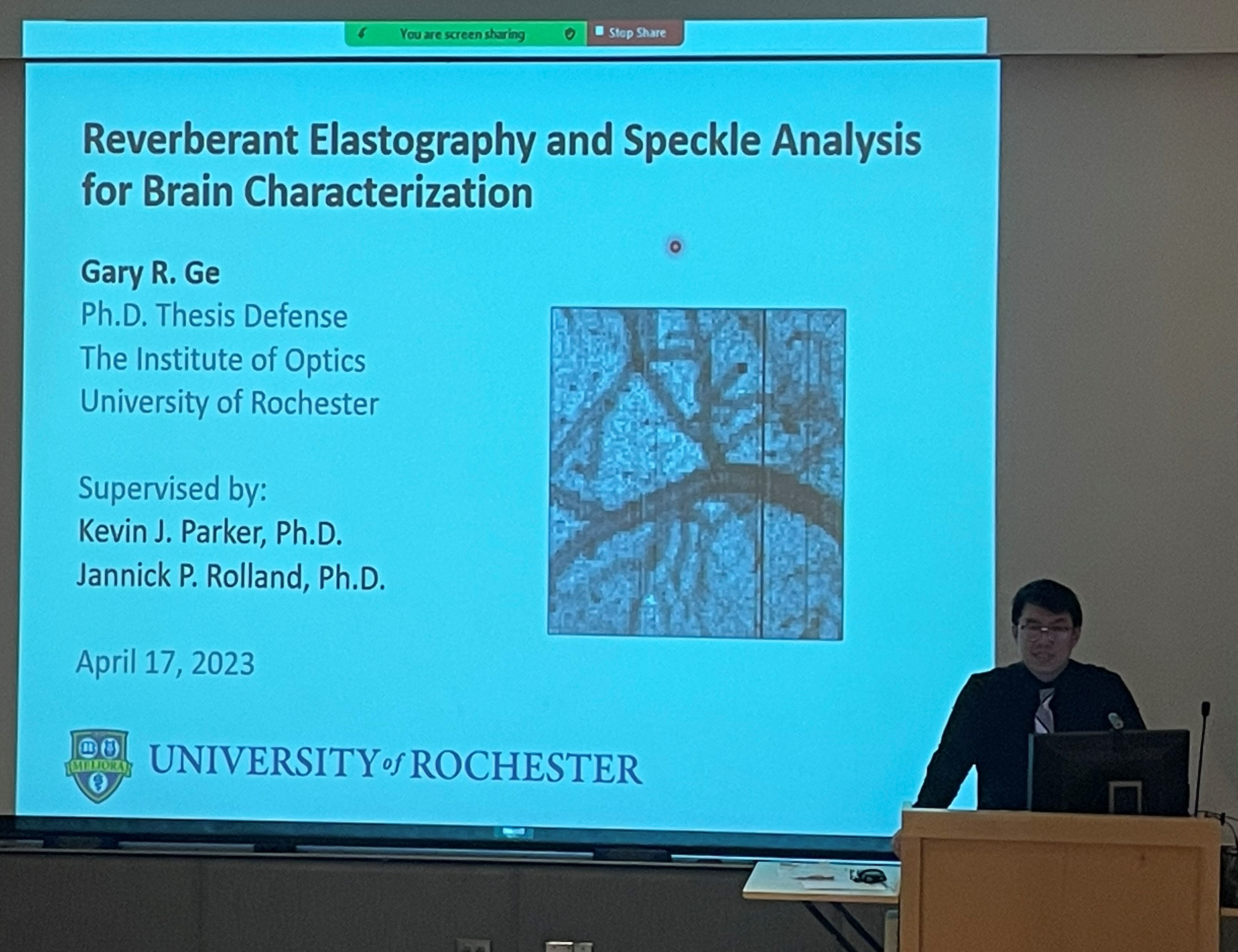 photo of gary ge defending his phd thesis