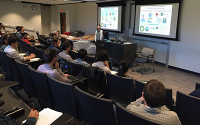 A professor giving a talk at an MRS seminar.