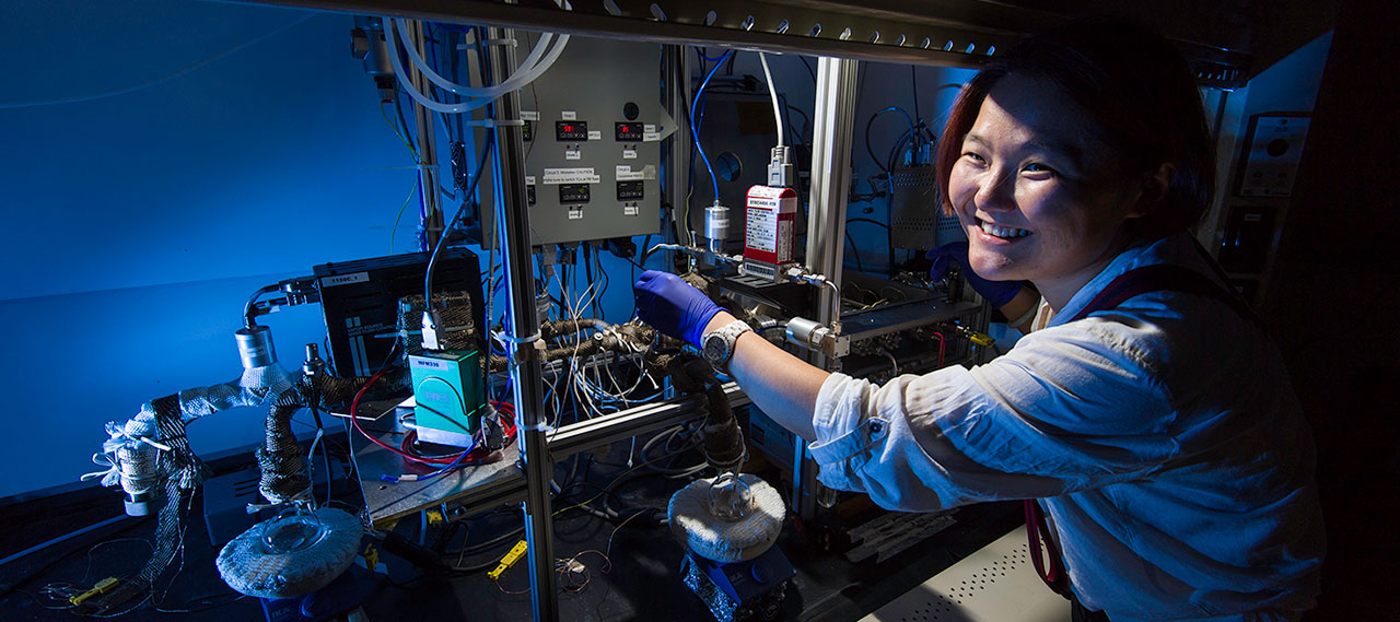 A graduate student working in a lab.