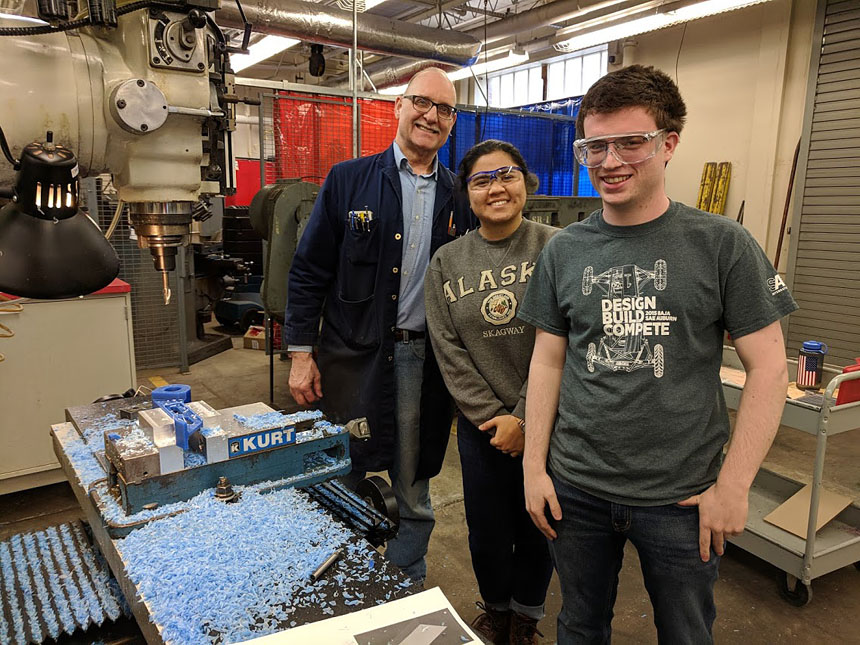 Students work with John Miller in Taylor Hall machine shop to create a wax prototype for a brake pedal.