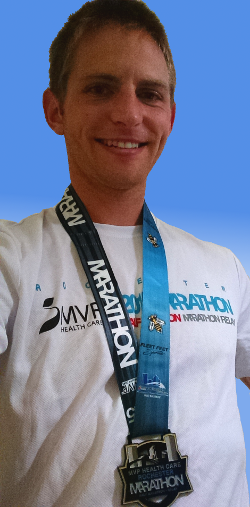 Image of Kenneth Goodfellow wearing marathon medal