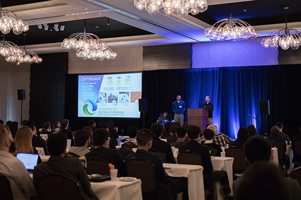 Optimax presents to the spring 2022 symposium attendees.
