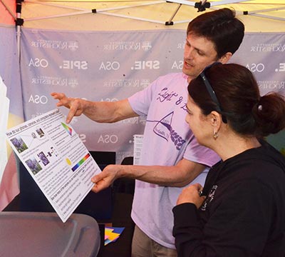 A professor explaining a display.