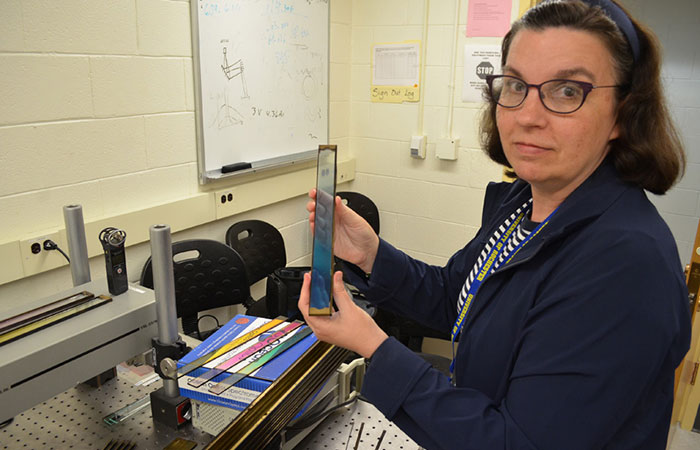 Jennifer Kruschwitz, assistant professor of optics, in her lab.