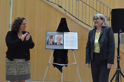 Nobel Laureate Donna Strickland and Dean Henzielman at a ceremony to unveil a commemorative plaque in Munnerlyn Atrium.
