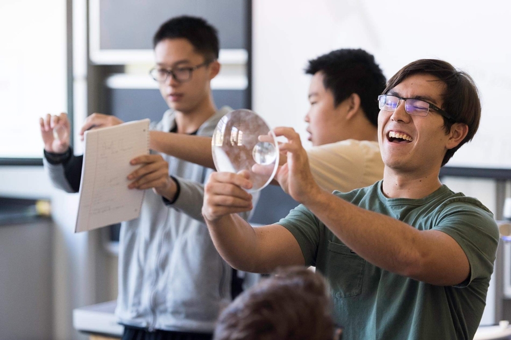 Optics students doing an experiment.