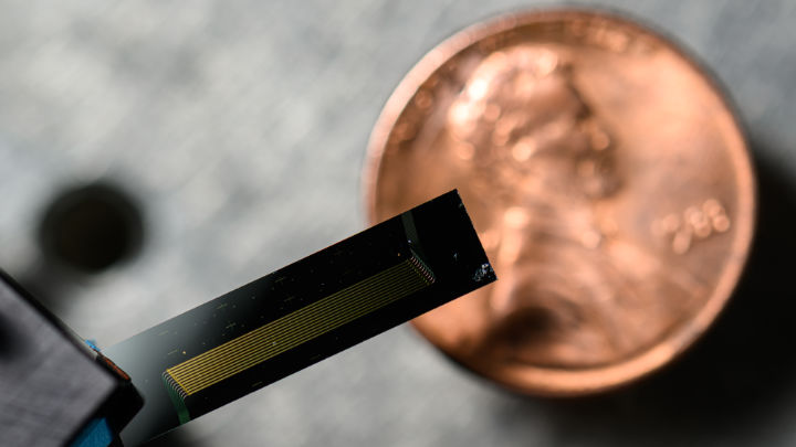 Chip-scale laser device (with penny for scale) made of thin film lithium niobate
