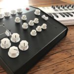 Our synth is housed in a black metal enclosure, and has no built in keyboard.