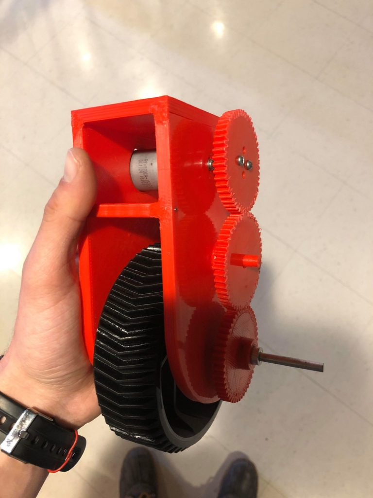 3D printed parts of the wheel, gears and the driving foot.