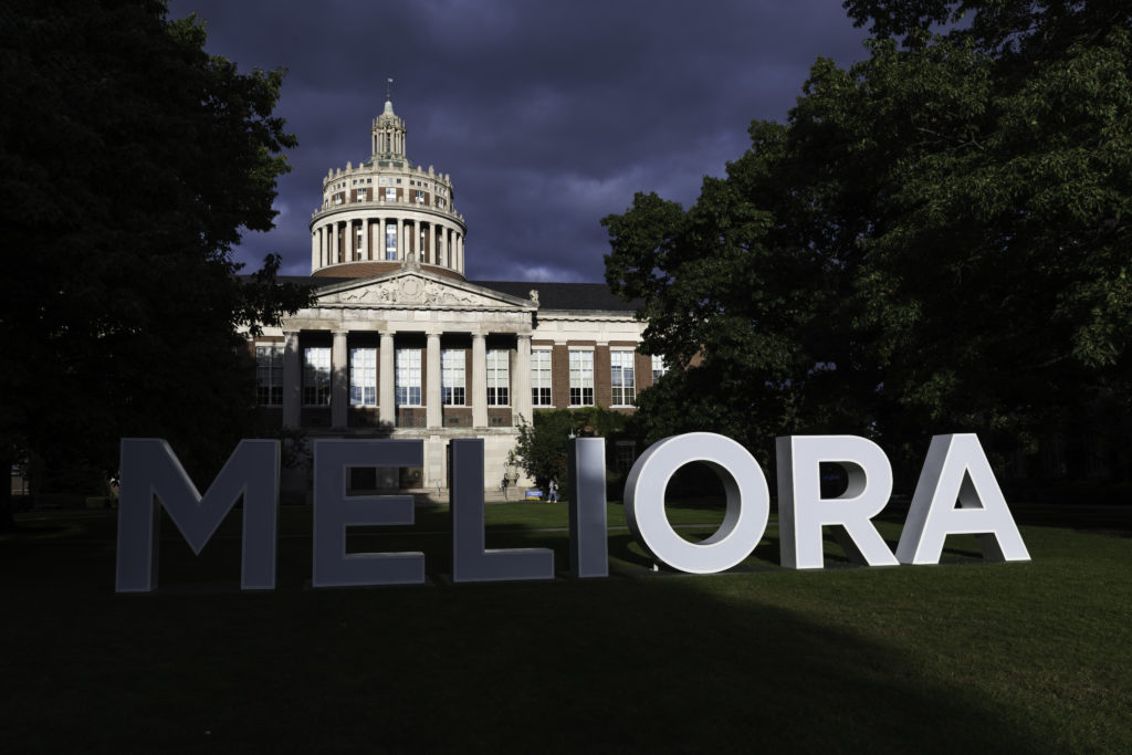 Large Meliora letters are pictured on Eastman Quad at sunset ahead of Meliora 2021